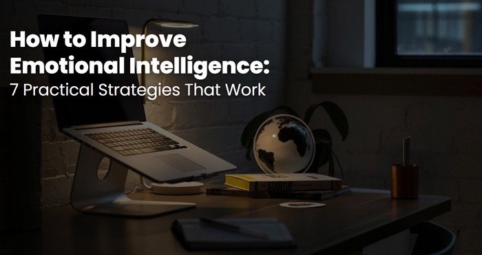 Quiet desk with a laptop, lamp and books at night, a calm space to improve emotional intelligence